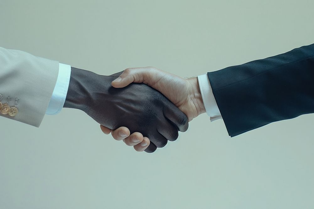 Business man hand shaking human handshake clothing.
