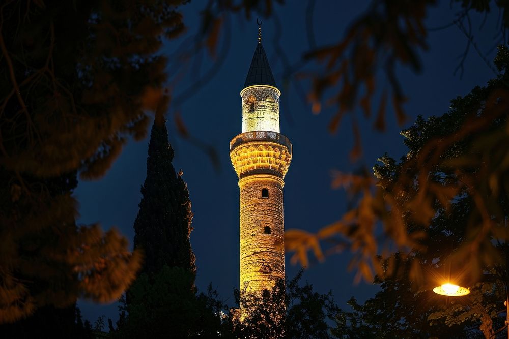 Illuminated minaret in famous architecture illuminated lighthouse.