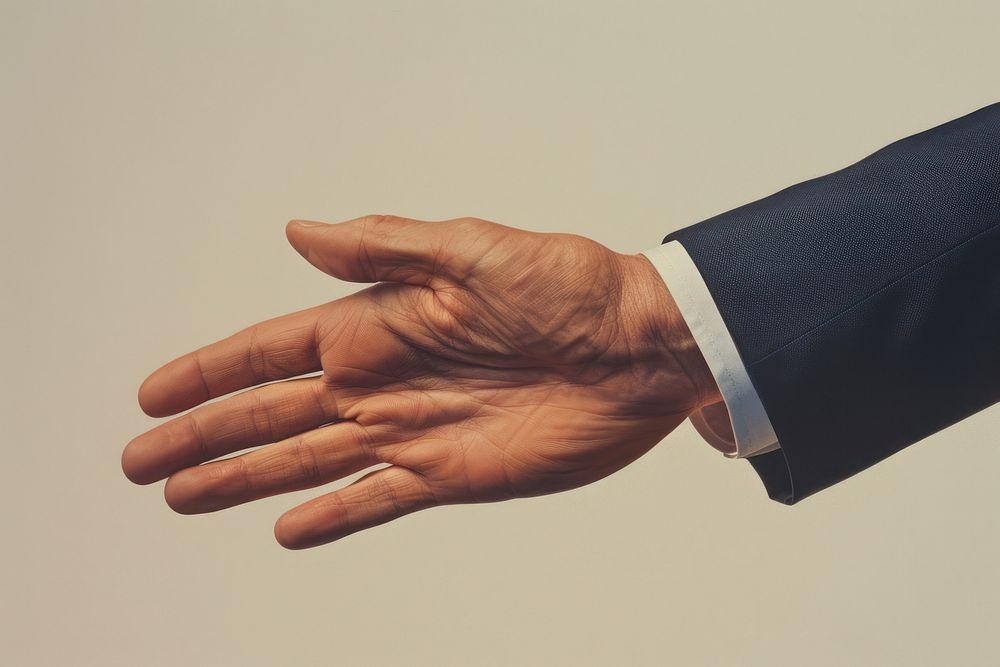 Business man hand shaking human person finger.
