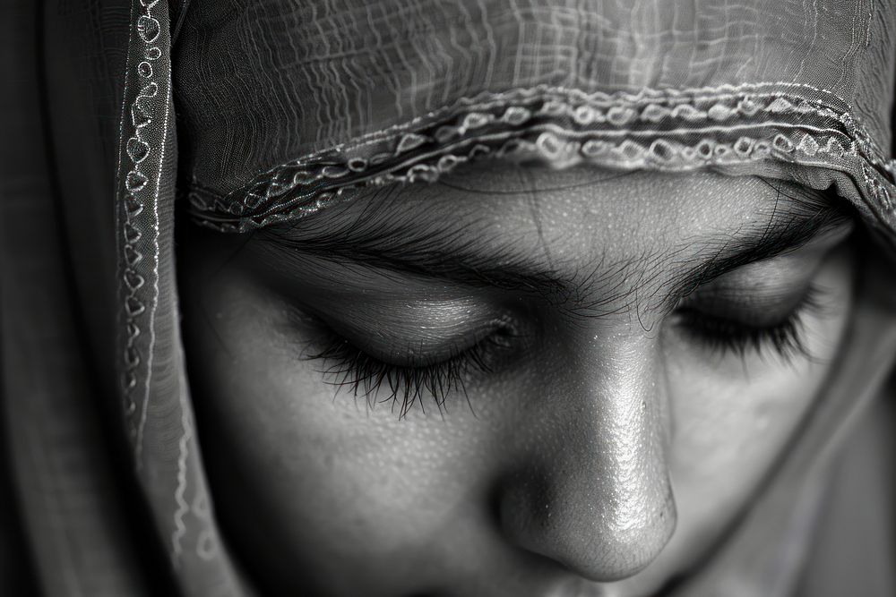 Muslim girl praying portrait black white.
