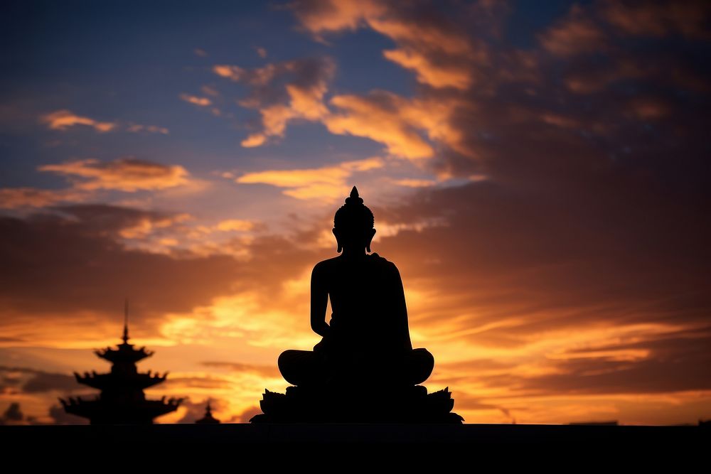 Buddha statue silhouette photography backlighting worship person.