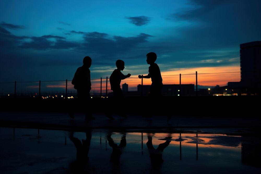 Children playing silhouette photography backlighting outdoors windmill.