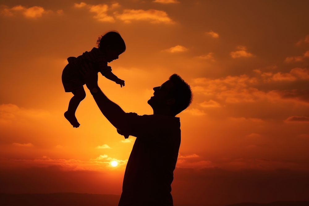 Person holding baby silhouette photography backlighting outdoors nature.
