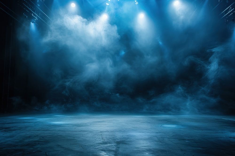 Illuminated stage with spotlights and smoke underwater lighting outdoors.