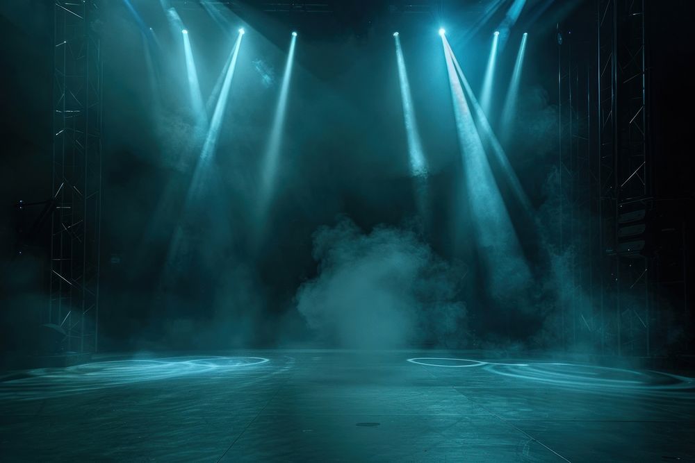 Illuminated stage with spotlights and smoke lighting outdoors indoors.