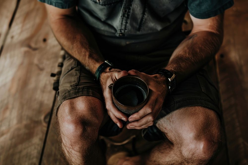 Guy holding a coffee mug photography beverage person.