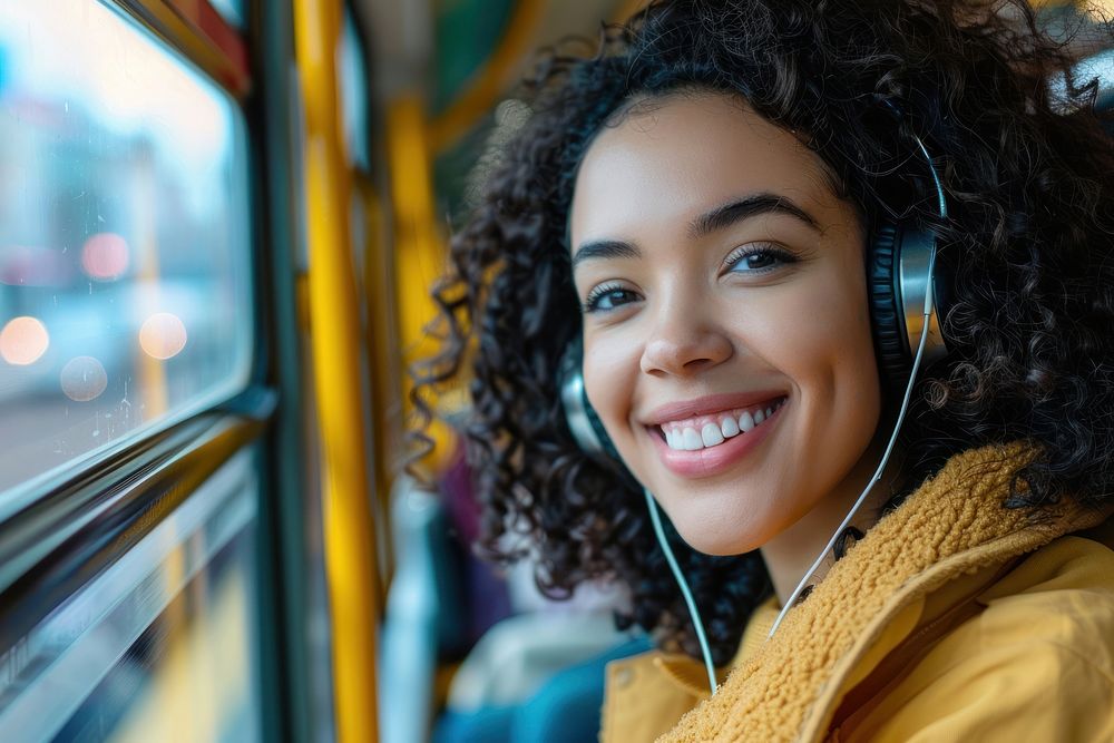 Happy young Thai woman with curly hair wearing headphones happy dimples person.