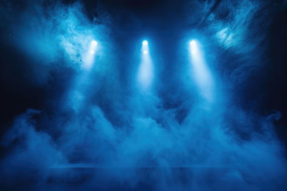 Stage with scenic lights and smoke spotlight lighting outdoors.