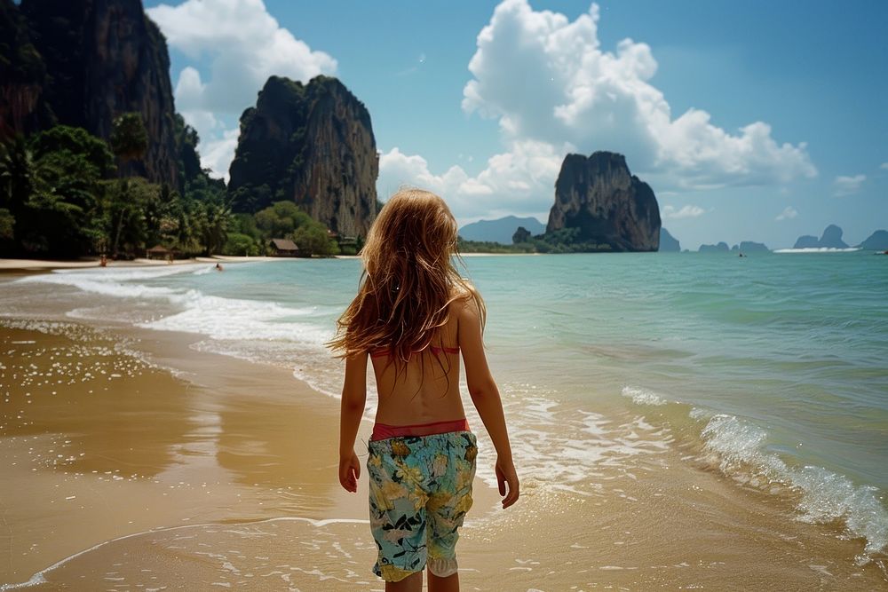 American girl on the Beach in Thailand beachwear shoreline clothing.