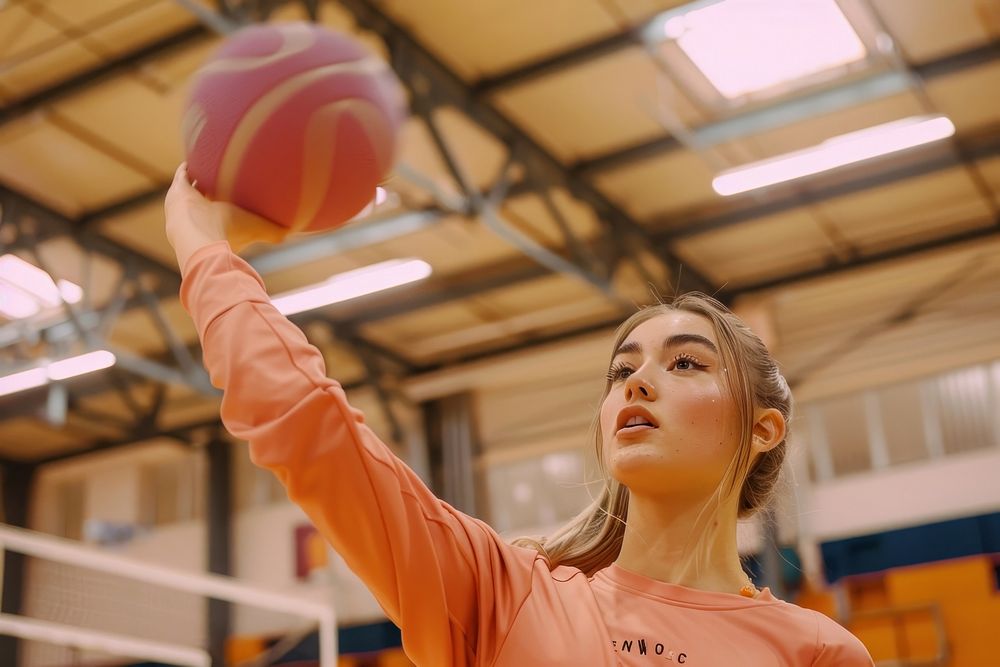 Girl playing sport indoor sports basketball volleyball.