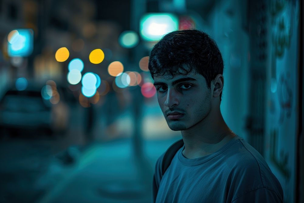 Lonely young Dubai man in the street Dubai photography sad portrait.