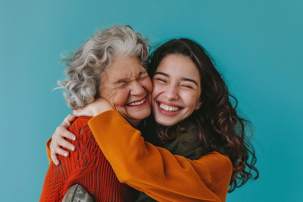 Elder parent mom with young adult daughter Lovely fun smiling happy caucasian hugging laughing.