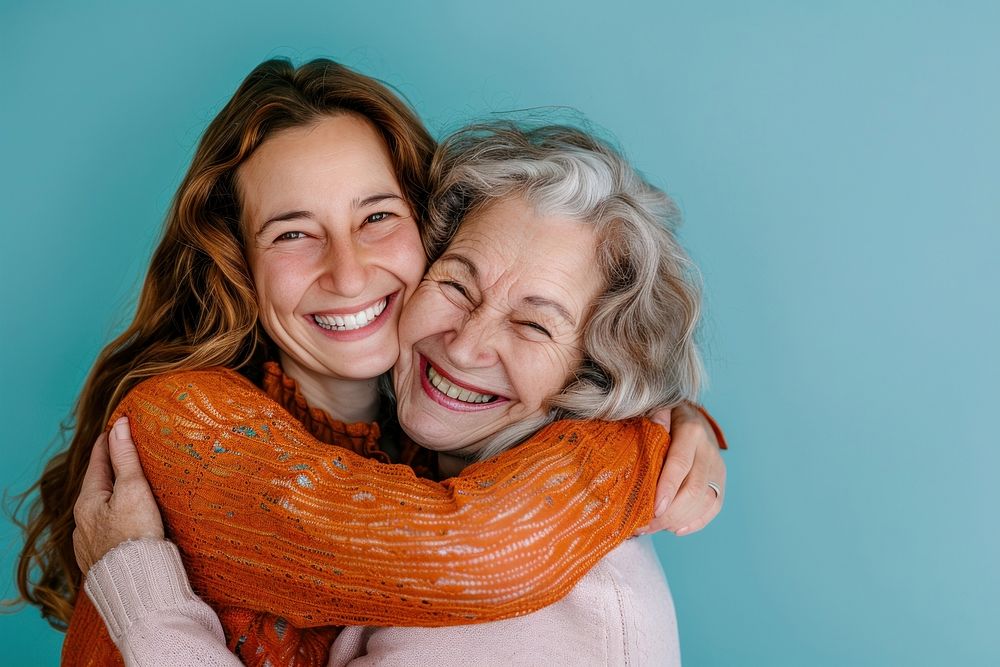 Elder parent mom with young adult daughter Lovely fun smiling happy caucasian hugging laughing.