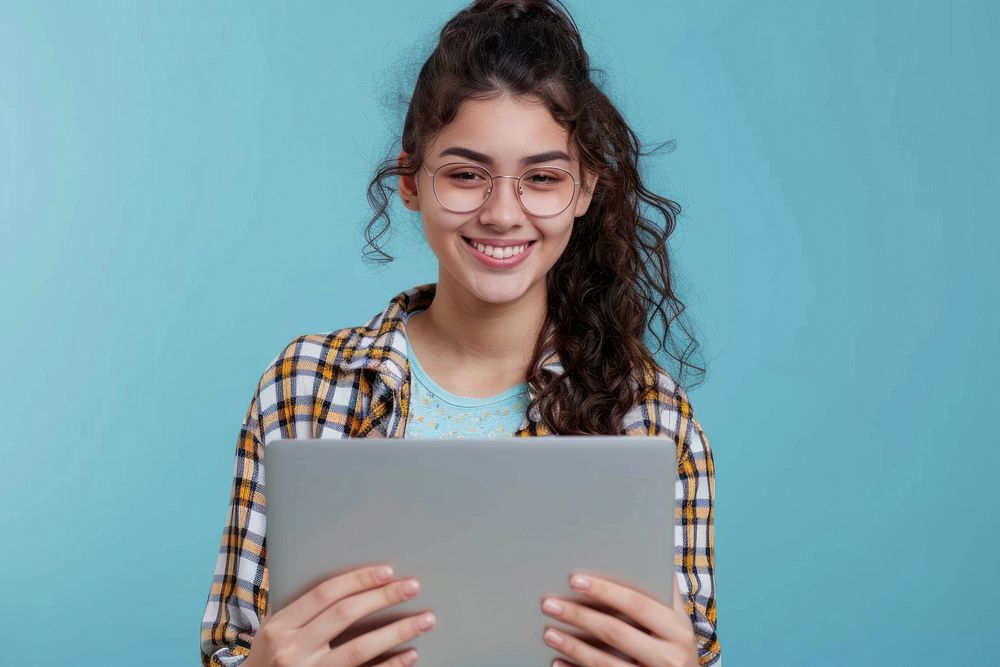 Using laptop device Young happy latin woman computer smiling.