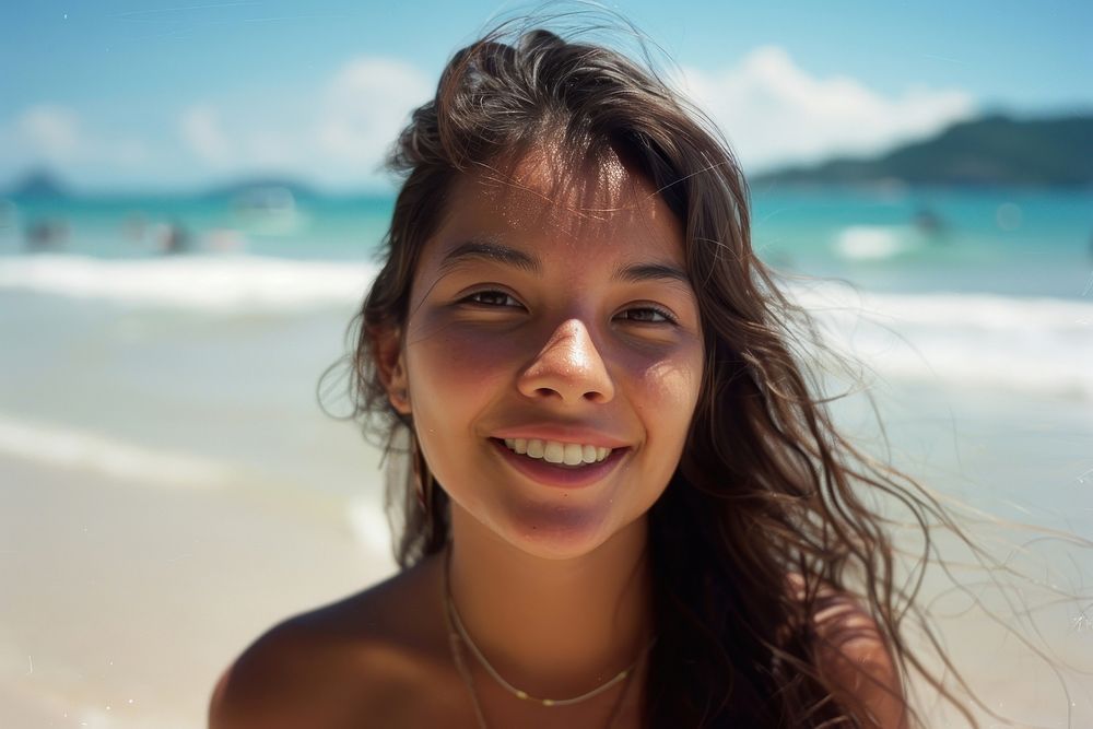 Portrait of beautiful Latin America young woman beach photography accessories.