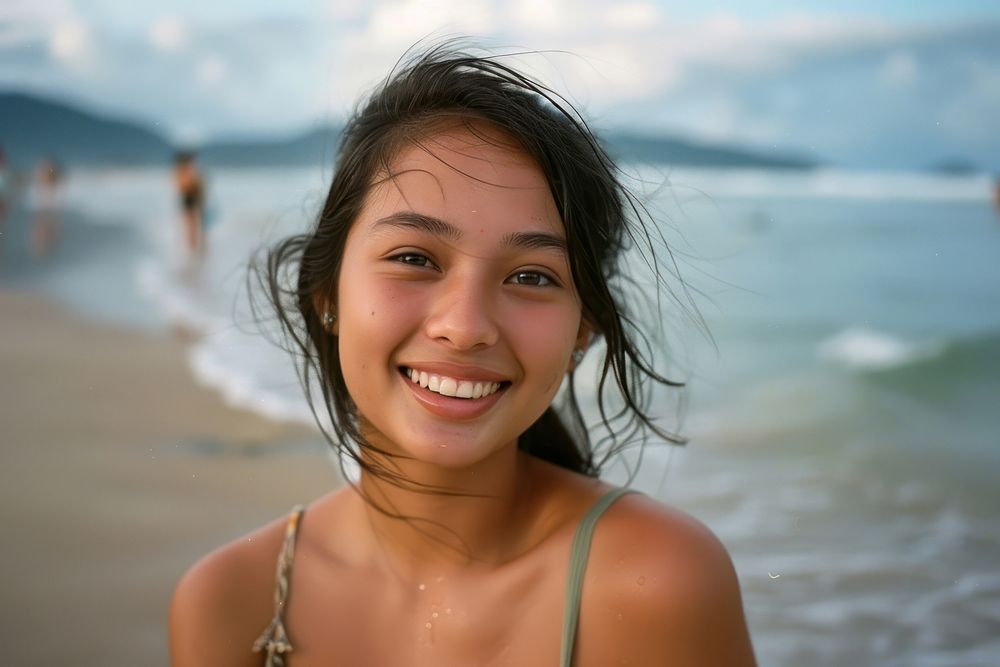 Portrait of beautiful young woman beach photography shoreline.