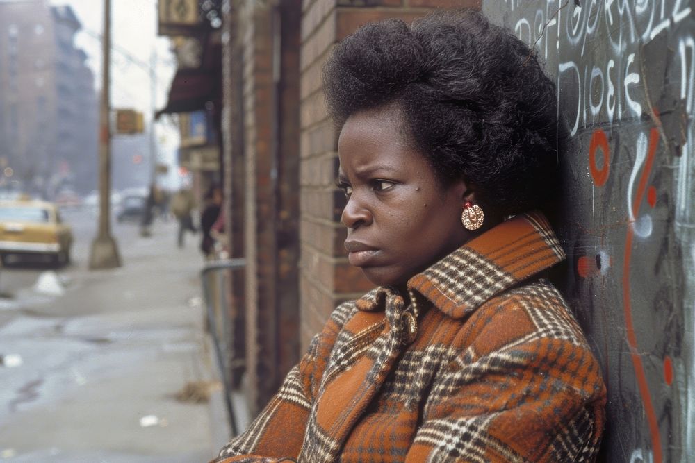A black woman portrait standing at street photography transportation automobile.