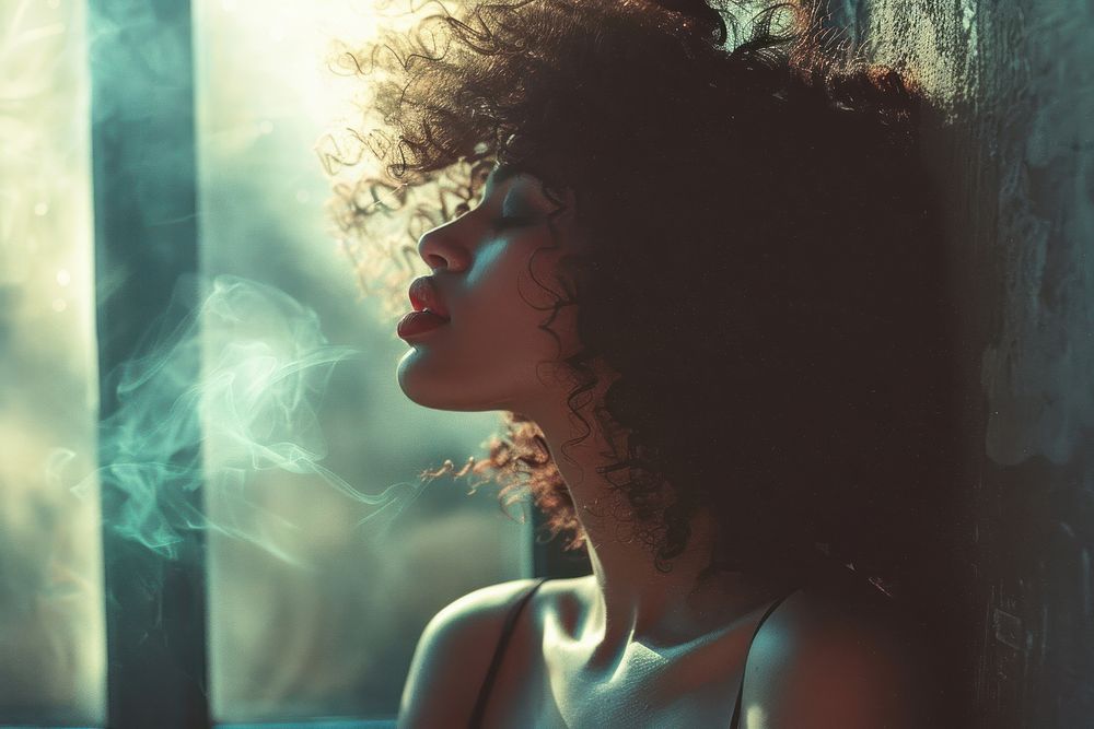 An asian black woman portrait standing at window side photography smoking person.