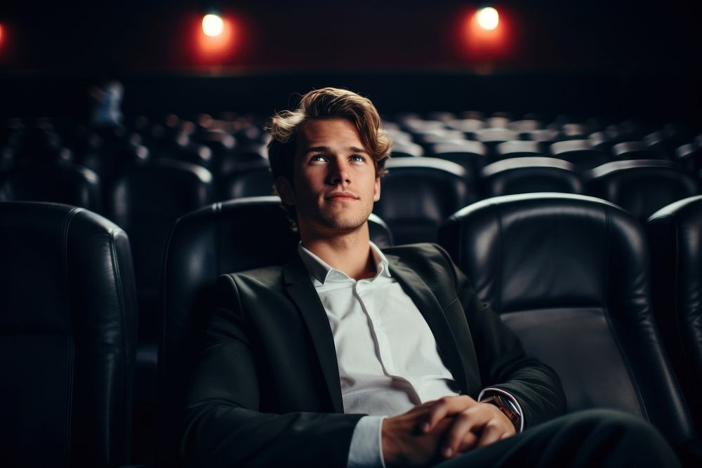 Portrait of handsome man at the movies portrait adult audience.