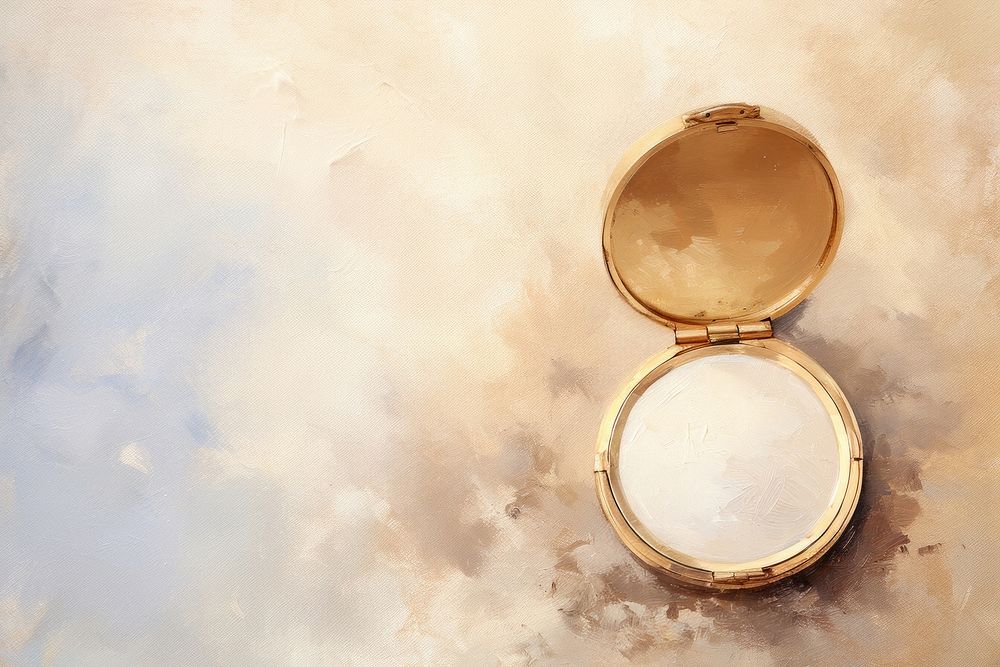 Close up on pale powder compact with mirror backgrounds painting jewelry.
