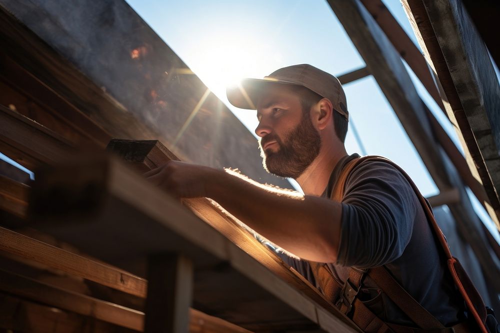 Engineer working in the roof of the construction house adult architecture accessories.
