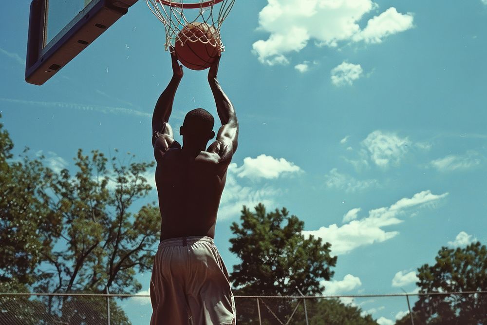 African American Basketball player playing basketball outdoors sports adult.