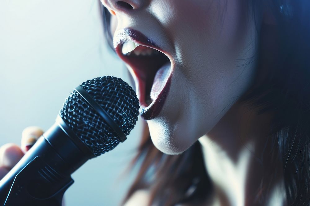 Woman microphone holding adult.