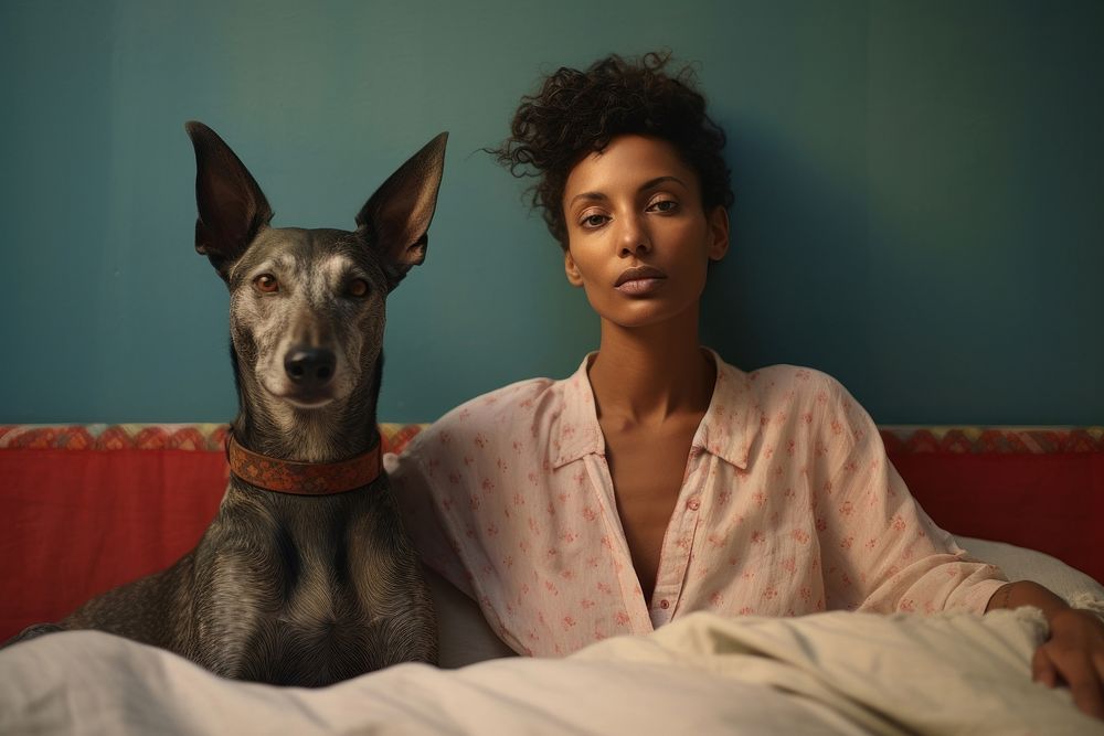 Happy african woman dog portrait bedroom.