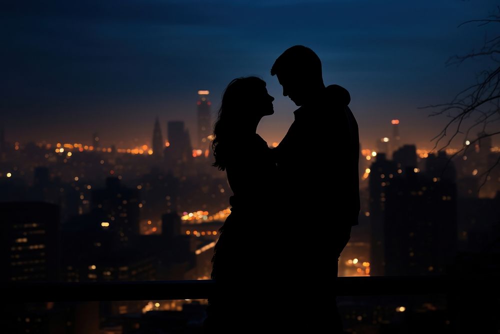 Couple hug silhouette photography night city backlighting.