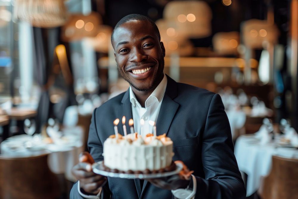 African man in suit impressed with birthday cake dessert people person.
