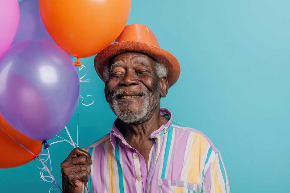 Elderly African man holding balloons happy photo photography.