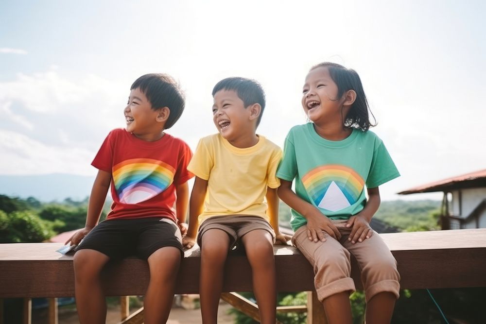 South east asian kids sitting together clothing apparel person.
