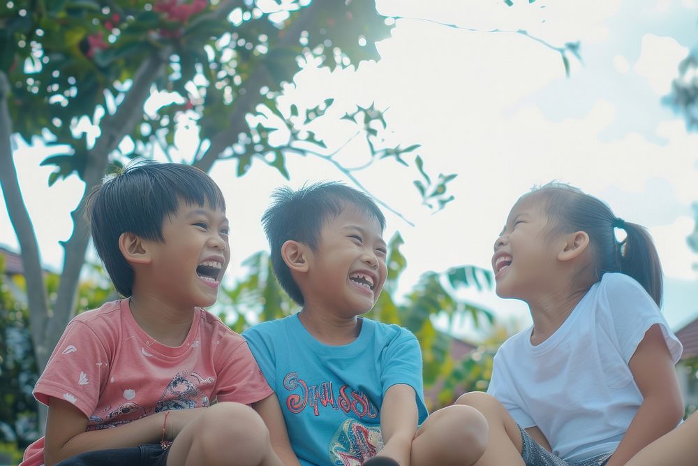 South east asian kids sitting together laughing photo photography.