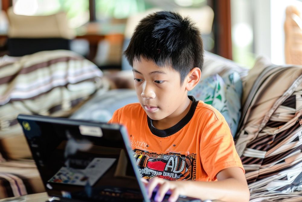 Young guy with labtop electronics furniture computer.