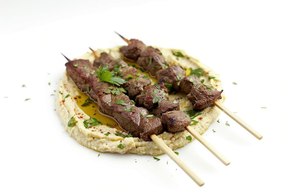 Hummus with beef skewers grilling cooking mutton.