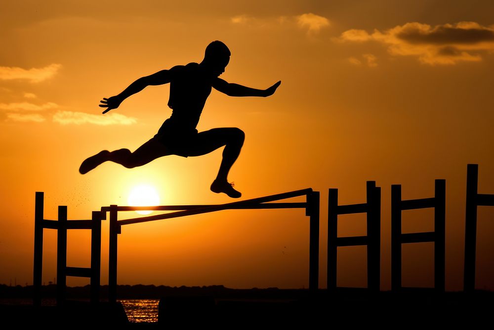 Athlete jumping backlighting person.