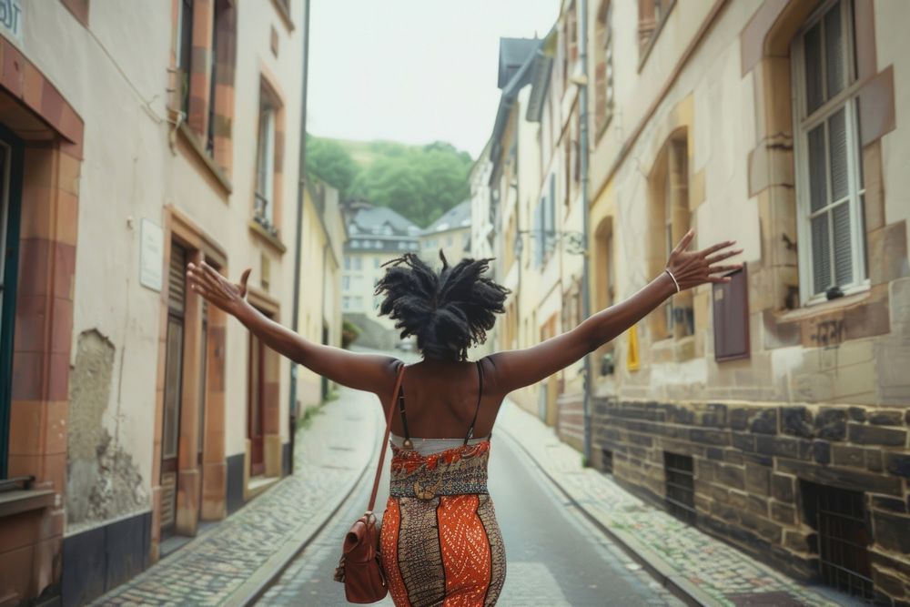 African female traveler street happy neighborhood.