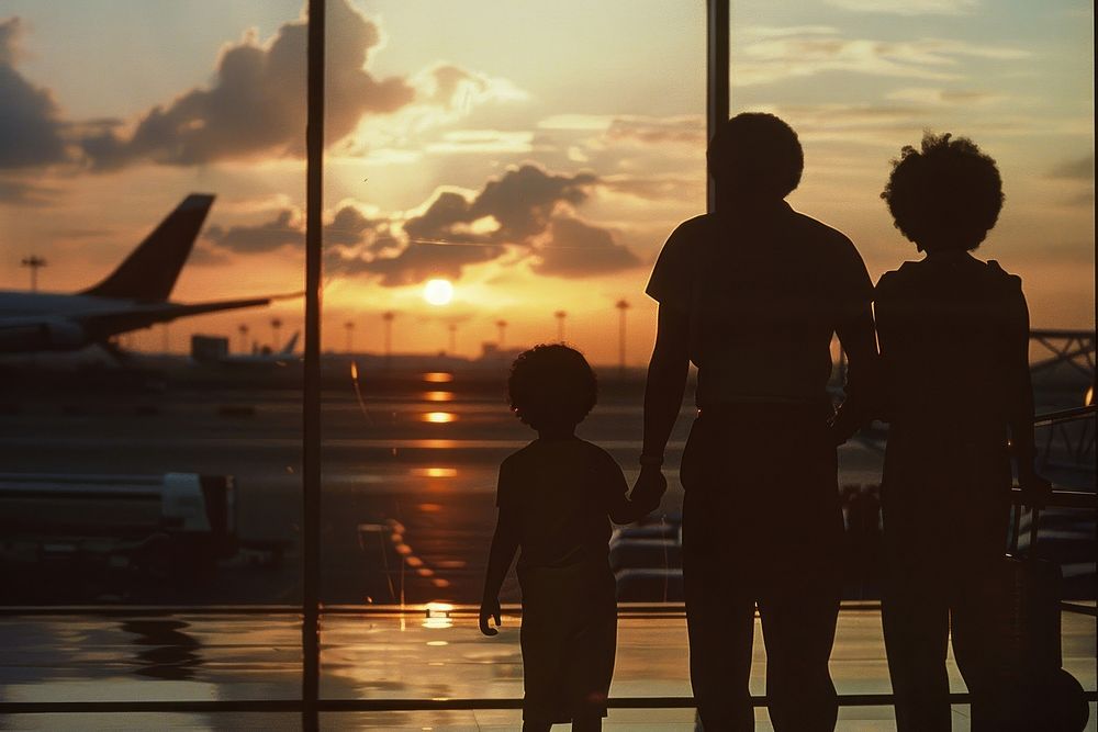 African young family silhouette airport transportation.