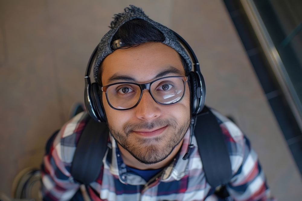 South asian man headphones glasses photo.