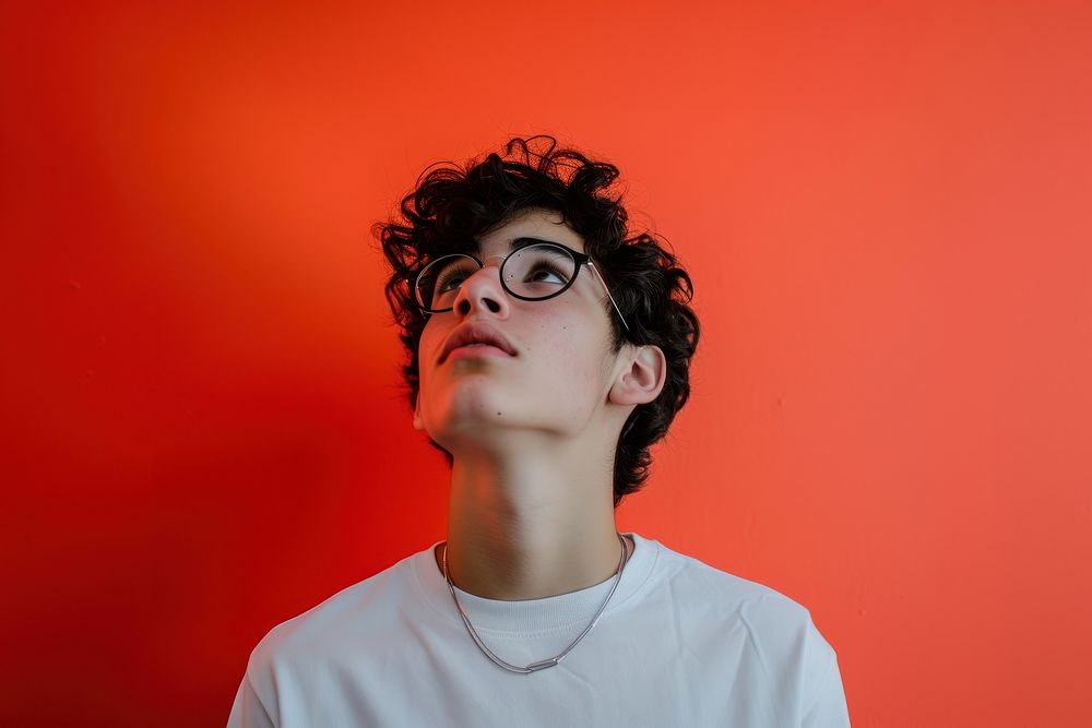 American student looking upwards portrait glasses contemplation.