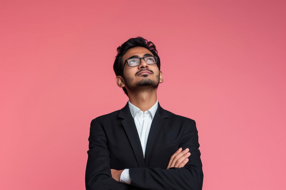 Indian businessman looking upwards portrait glasses adult.