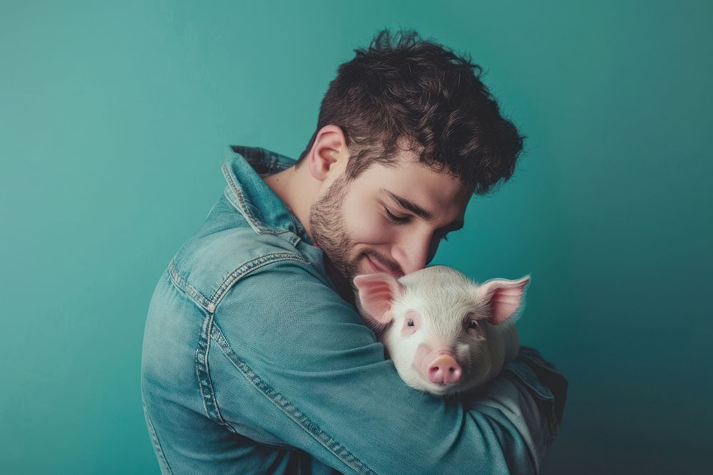 Man hugging piggy person animal mammal.