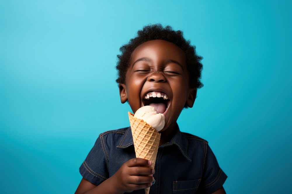 Black kid eating ice cream laughing dessert person.