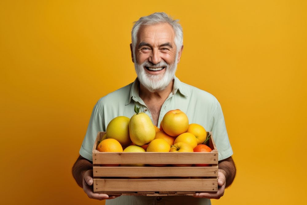 Old man farmer smiling holding vegetable crate laughing produce person.
