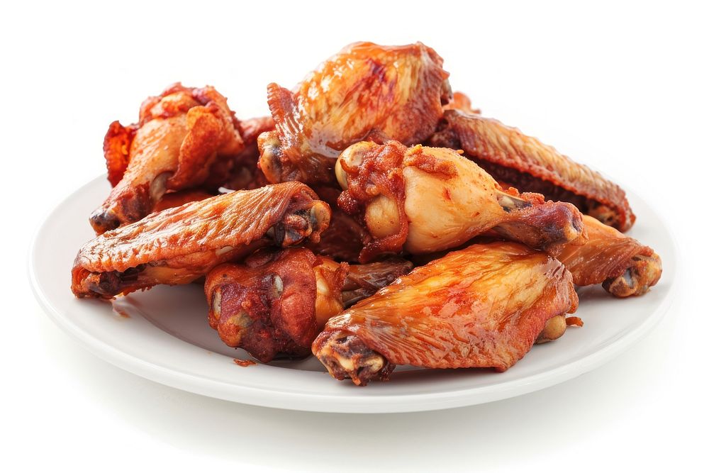 Photo of fried chicken wings grilling cooking poultry.