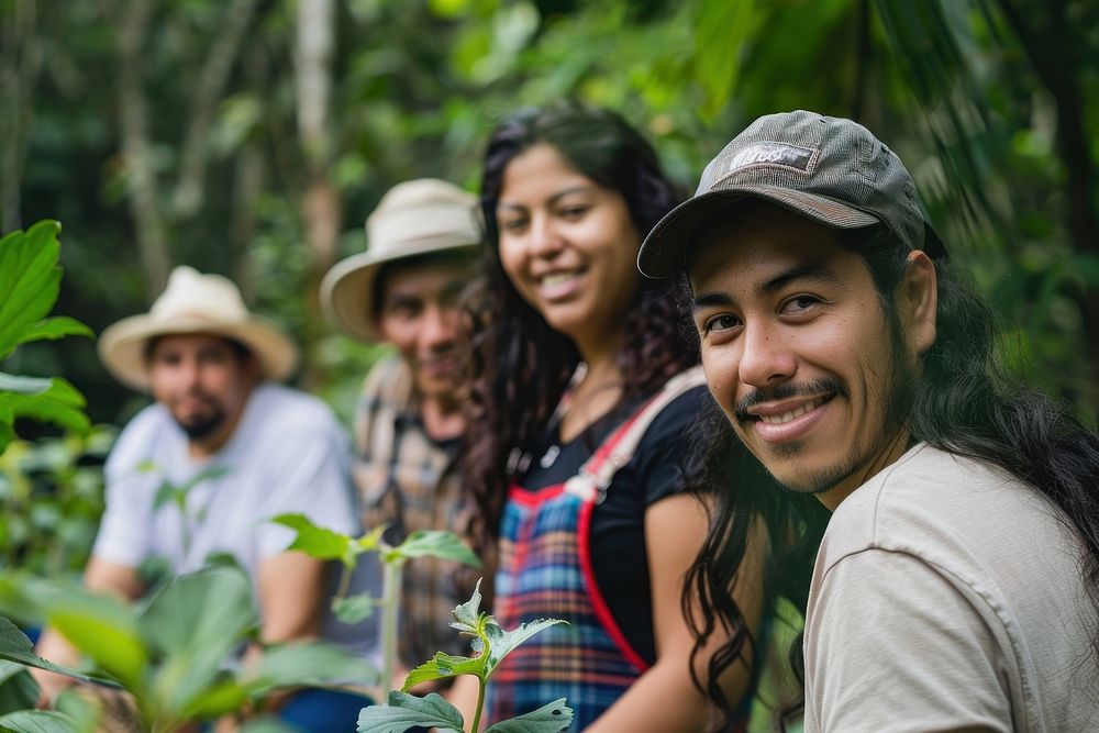 Photo of hispanic volunteer group plant vegetation clothing.