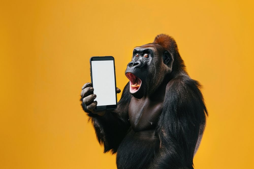Photo of shocked gorilla surprised wildlife phone.