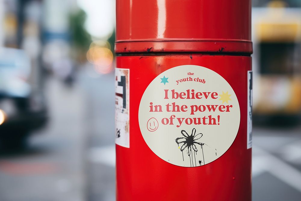 Motivational sticker on red tube