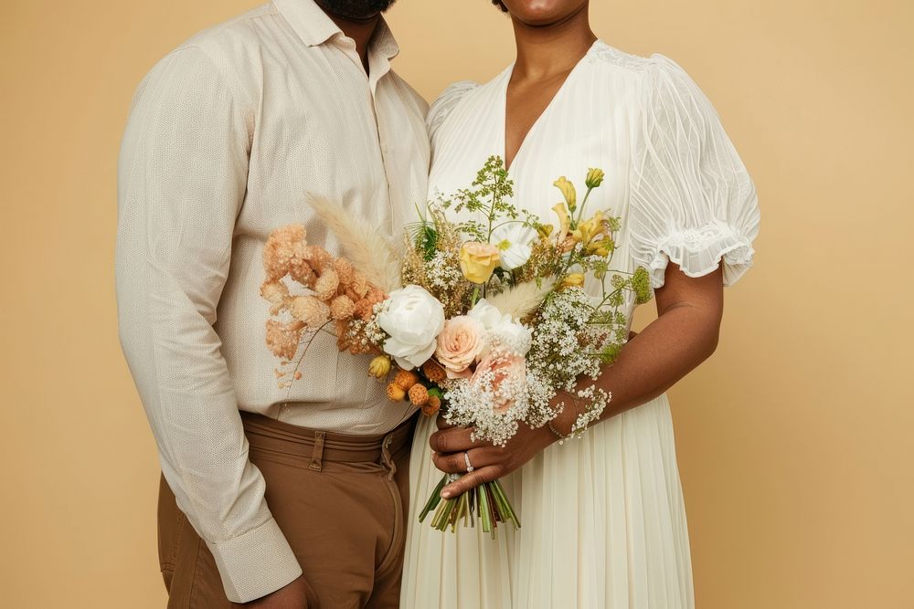 Chubby couple wearing a minimal wedding dress bridegroom clothing blossom.