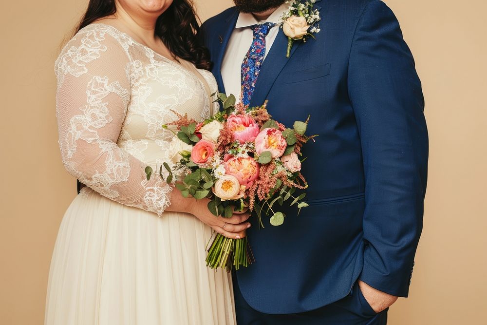 Chubby couple wearing a minimal wedding dress photography bridegroom clothing.
